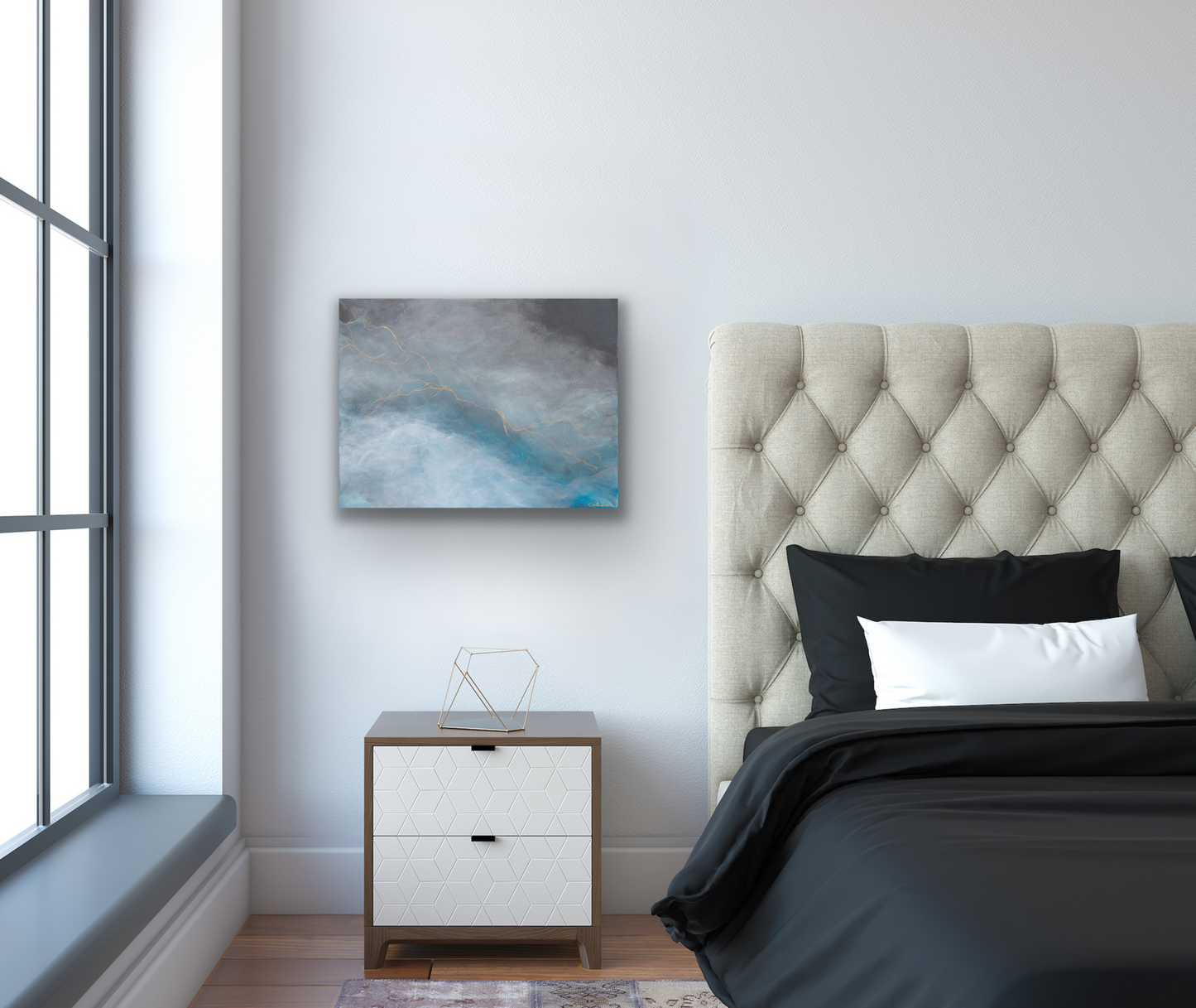 This colourful abstract art piece has a colour palette of blue, white, grey and a little gold. THe range of clours will allow you to more easily match to the decor within your chosen room of placement.
