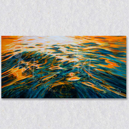 "Evening Fire" wall art captures the evening lights hitting the waves in an ever changing masterpiece of light and movement.