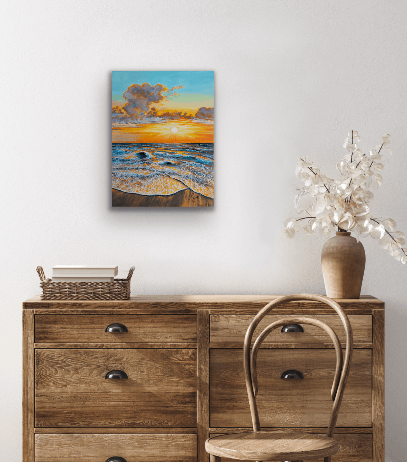 This original painting is of a stunning sunset over a beach with gentle waves.